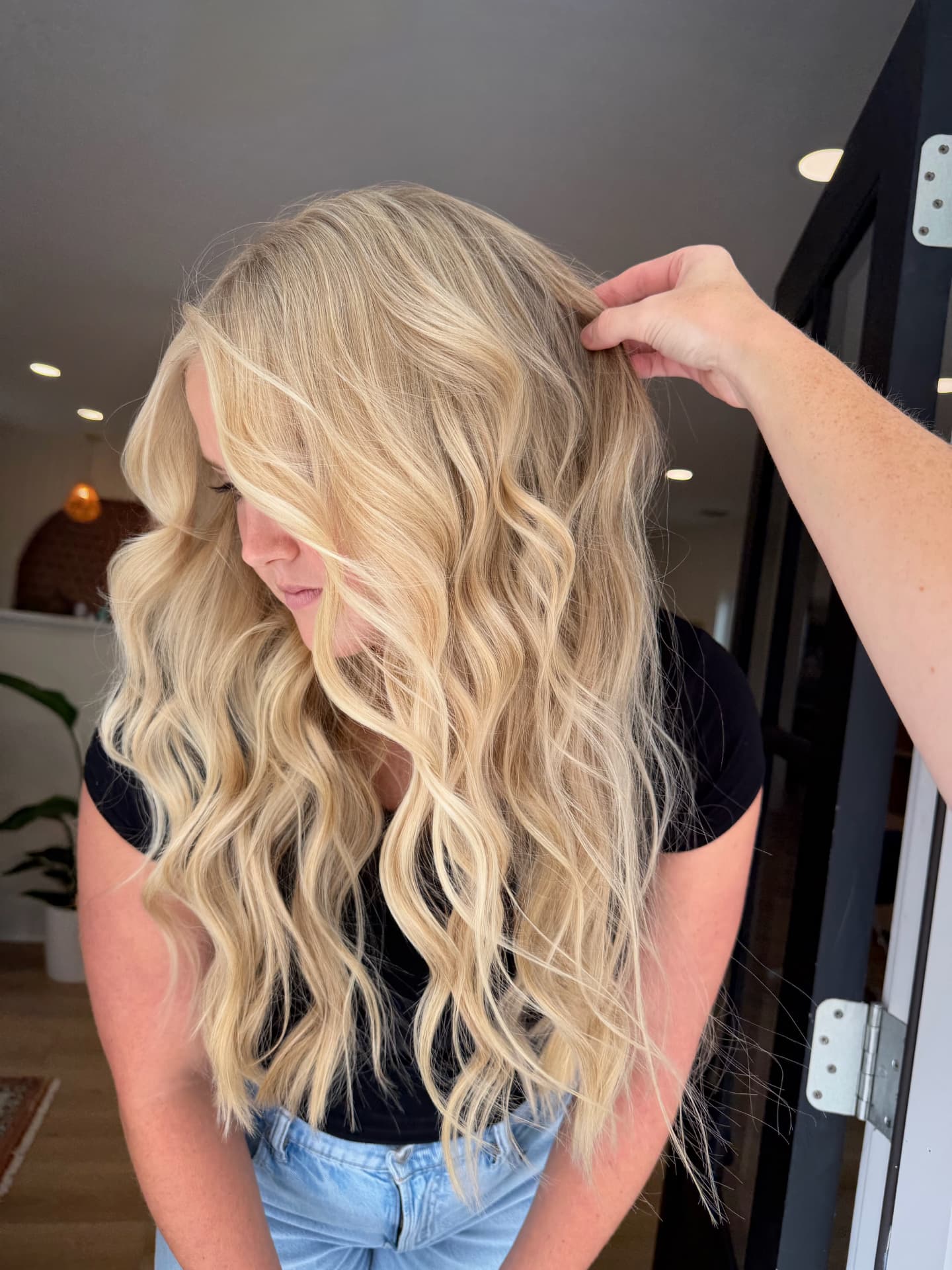 Long voluminous blonde waves with seamless hand-tied extensions by Mill & Mane, Tipp City